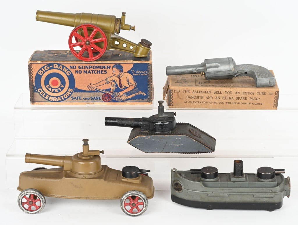 BIG BANG LOT: Includes Big Bang Safety Pistol, Cannon, Tank, Gun Boat, and Tank on Wheels. All in original condition. Comes with some boxes and paperwork. Largest 9" Excellent