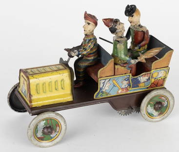 HANS EBERL TIN WINDUP TA-RA-RA-BUMM CLOWN CAR: German tin windup Ta-Ra-Ra-Bumm Clown Car. All original and complete. Toy has nice colors and graphics. Windup works and clowns all moved. Nice example of this desirable toy. 7" Excellent