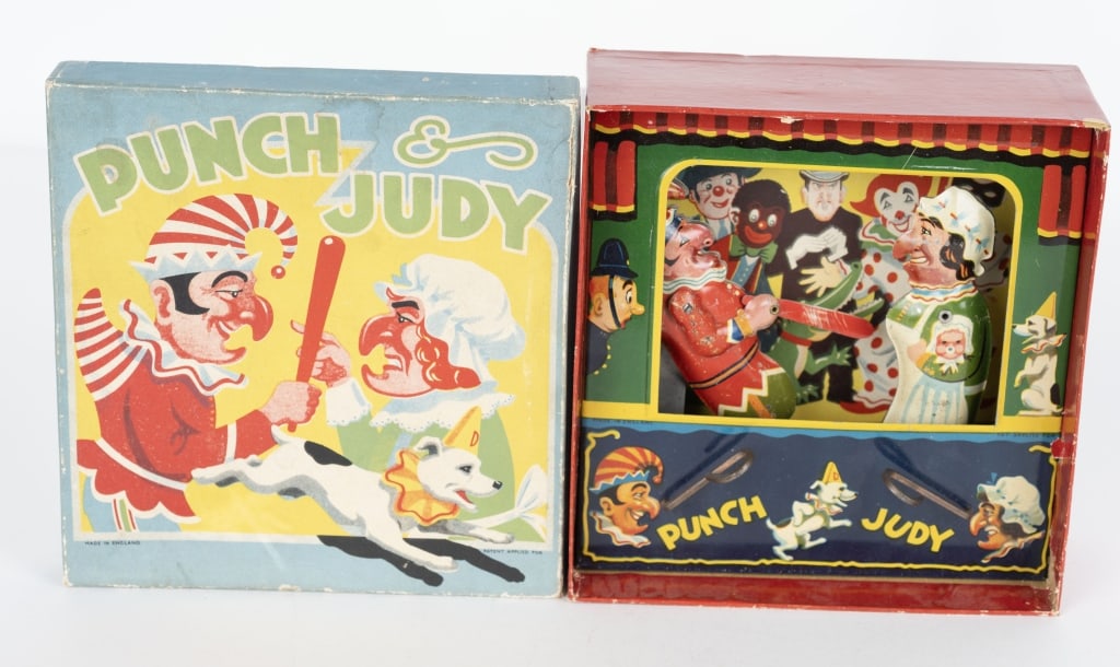 ENGLISH TIN MECHANICAL PUNCH & JUDY w/ BOX: Unusual tin Punch & Judy Theater made in England. Very colorful toy with tin theater with Punch & Judy figures. Has handles where you can control Punch and Judy. Great colors and graphics. Comes with 