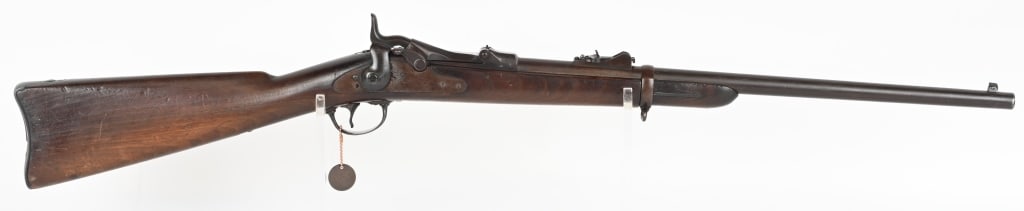 ANTIQUE SPRINGFIELD MODEL 1884 TRAPDOOR CARBINE: SERIAL NUMBER: 450340. BARREL: 22". CALIBER: .45-70. MANUFACTURED: 1889. "22" rack number on the left side of the chamber. "1884" dated breech block. Standard markings on the lock plate. Likely a fiel