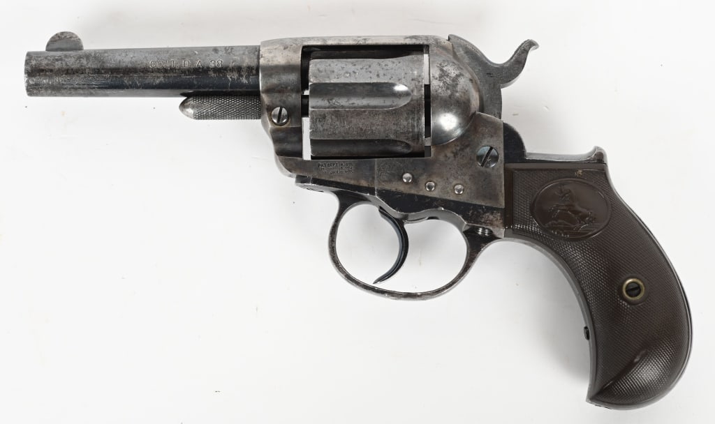 ANTIQUE COLT MODEL 1877 LIGHTNING DA REVOLVER: SERIAL NUMBER: 84997. BARREL: 3-1/2". CALIBER: .38 COLT. MANUFACTURED: 1891. Two line company address on the top of the barrel, with "COLT. D.A. 38" marked on the left side. Three line patent dates on