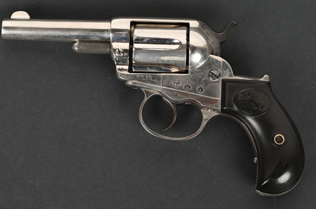 COLT MODEL 1877 ?LIGHTNING? DA REVOLVER: Serial number 17979, 3-1/2 inch barrel without ejector (aka Sheriff?s Model) Manufactured approximately 1879. Chambered in .38 Colt. Nickel plated with black hard rubber 2-piece grips. CONDITION: Fine