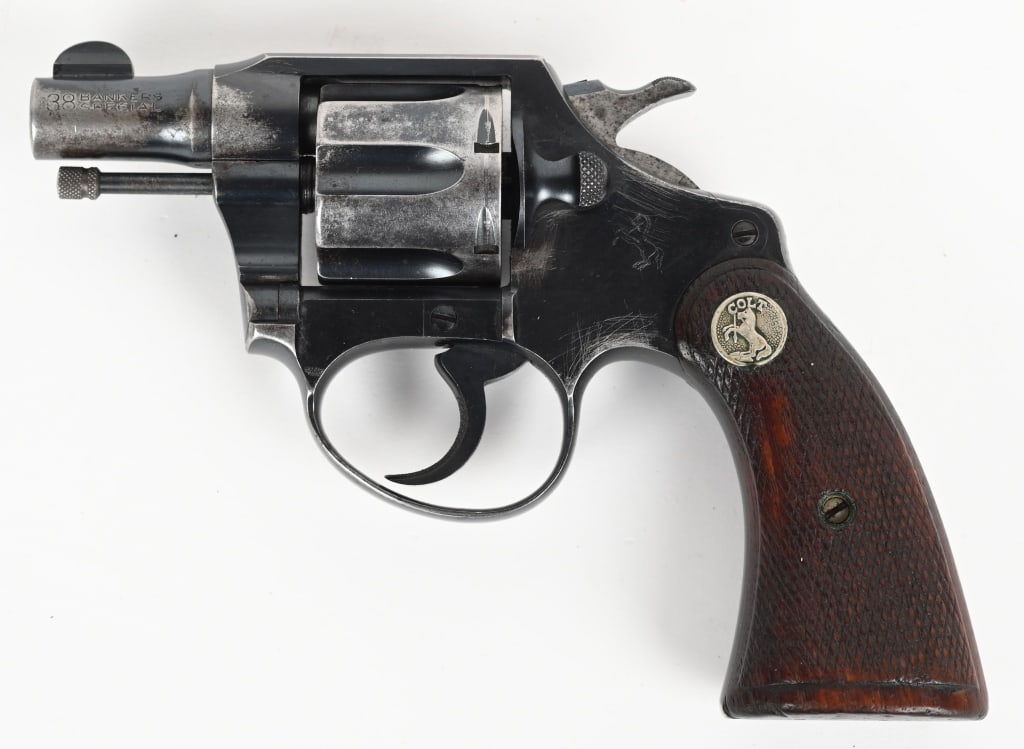 RAILWAY MAIL SERVICE COLT BANKERS SPECIAL .38 S&W: SERIAL NUMBER: 349336. BARREL: 2". CALIBER: .38 S&W. MANUFACTURED: 1931. Marked "R.M.S. P.O. DEPT." marked on the backstrap, meaning Railway Mail Service. Property number: "No.10696" marked on the but