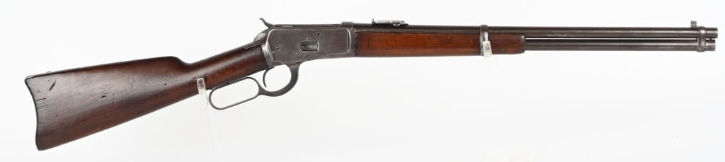 WINCHESTER MODEL 1892 SADDLE RING CARBINE: SERIAL NUMBER: 732740 BARREL: 20-inch round CALIBER: .44-40 WCF cartridge. MANUFACTURED: 1912 Square block with blade front and carbine style ladder express rear barrel sights. Plain walnut forearm an