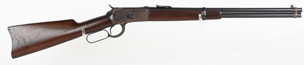WINCHESTER MODEL 1892 SADDLE RING CARBINE: SERIAL NUMBER: 792669 BARREL: 20-inch round CALIBER: .44-40 WCF cartridge. MANUFACTURED:1914. Square block with blade front and carbine style, ladder express rear barrel sights. Plain walnut forearm a
