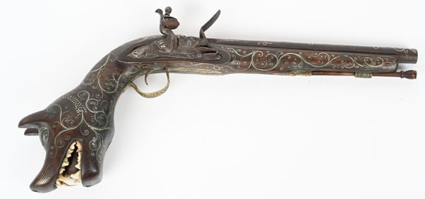 EXTREMELY ORNATE DOG HEAD CARVED FLINTLOCK PISTOL