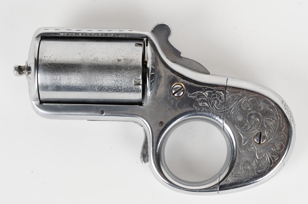 JAMES REID MY FRIEND MODEL .32 CAL KNUCKLE-DUSTER: SERIAL NUMBER: 17073. BARREL: 1-3/4". CALIBER: .32 CALIBER RIMFIRE. MANUFACATURED: 1870S. "MY FRIEND PATD. DEC.26.1865" marked on the left side of the top strap. Matching serial on the trigger and fra