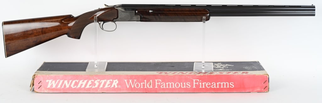 WINCHESTER MODEL 101 20 GAUGE PIGEON GRADE: SERIAL NUMBER: PK250286. BARREL: 26". CALIBER: 20 GAUGE. MANUFACTURED: 1970S. Made in Japan. "PIGEON GRADE" marked on top of the matted vent rib. White plastic bead front sight. Blued barrels with coi