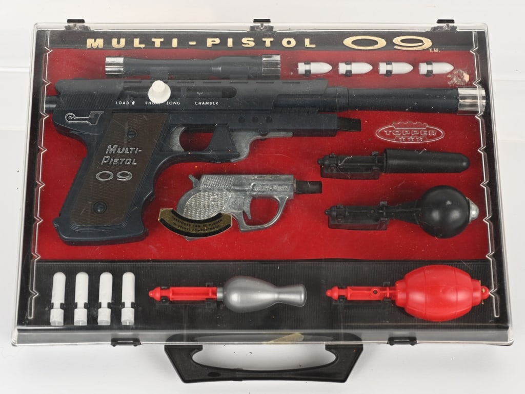 1965 TOPPER MULTI-PISTOL 09 w/ BOX: Never played with and complete with all accessories. Still in plastic case. 13" Excellent