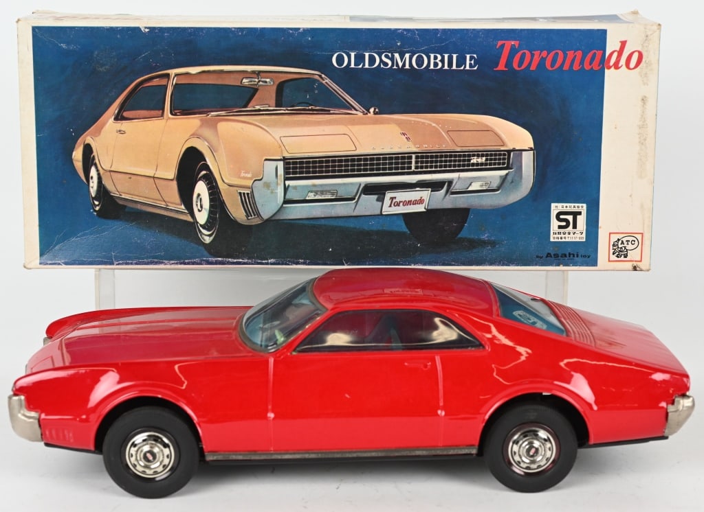 JAPAN TIN FRICTION OLDSMOBILE TORNADO w/ BOX: All original. Large and impressive car. Friction not working. Boxed 16" Excellent