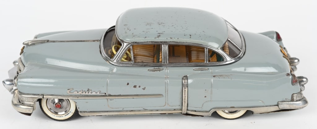 MARUSAN TIN FRICTION 1954 CADILLAC SEDAN: Wonderful all original 1954 Cadillac tin friction Car. Great details. Friction works. Has some minor wear. 12" Excellent