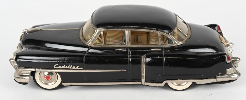 MARUSAN TIN FRICTION 1954 CADILLAC SEDAN: Wonderful all original 1954 Cadillac tin friction Car. Great details. Friction not working. 12" Excellent