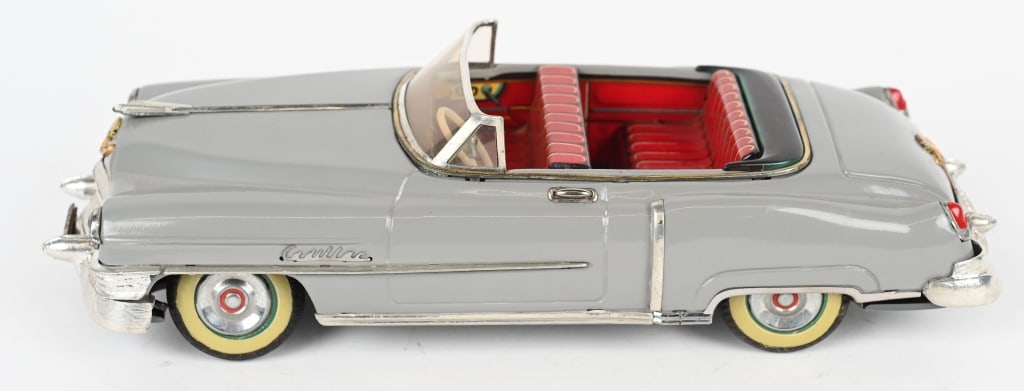 MARUSAN TIN FRICTION 1954 CADILLAC SEDAN: Wonderful restored 1954 Cadillac tin friction Car. Great details. Friction not working. 12" Excellent
