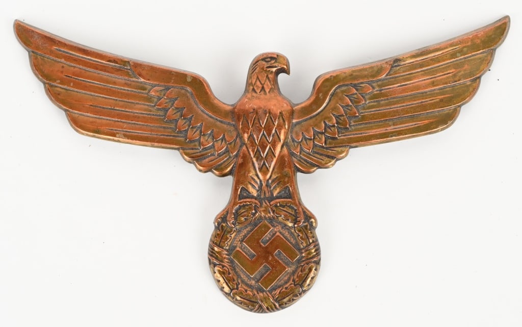 WWII NAZI GERMAN NSDAP GORGET EAGLE W ATTACHMENTS: Stamped alloy gorget eagle with a bronze wash. The stylized, bronze washed, embossed national eagle with outstretched wings with a raised outer edge lip with an embossed, repeating, oak-leaf pattern.