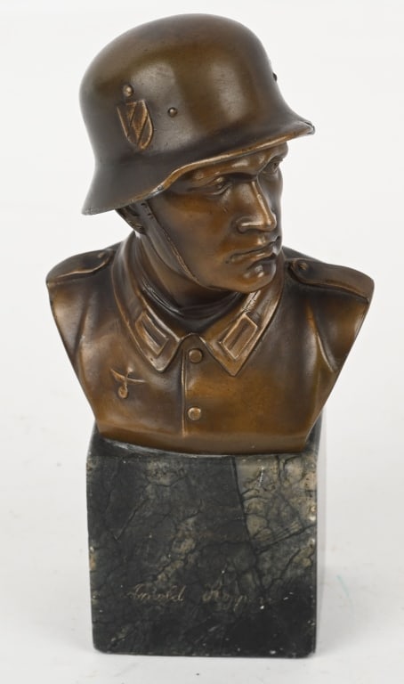 WWII NAZI GERMAN HEROIC BUST OF HEER SOLDIER WW2: WWII Nazi German Heroic bust of a German soldier wearing a M35 combat helmet and uniform measuring 8 inches tall including the base. The bust is in smelter and is given a pleasing bronze finish with s