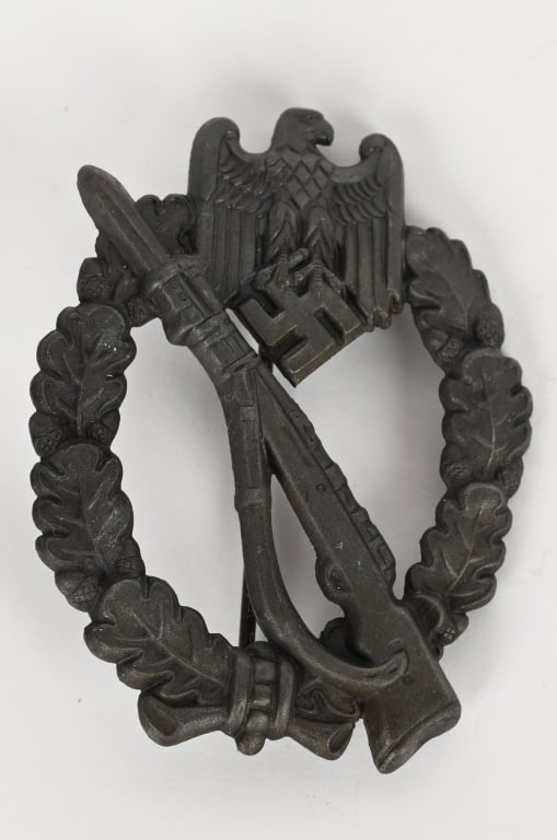 WWII NAZI BRONZE INFANTRY ASSAULT BADGE FRANK REIF: Die struck, semi solid backed, alloy award with bronze wash. The nicely detailed badge features an embossed, vertically oval, oak-leaf wreath with a Wehrmacht style eagle with down-swept wings, superi
