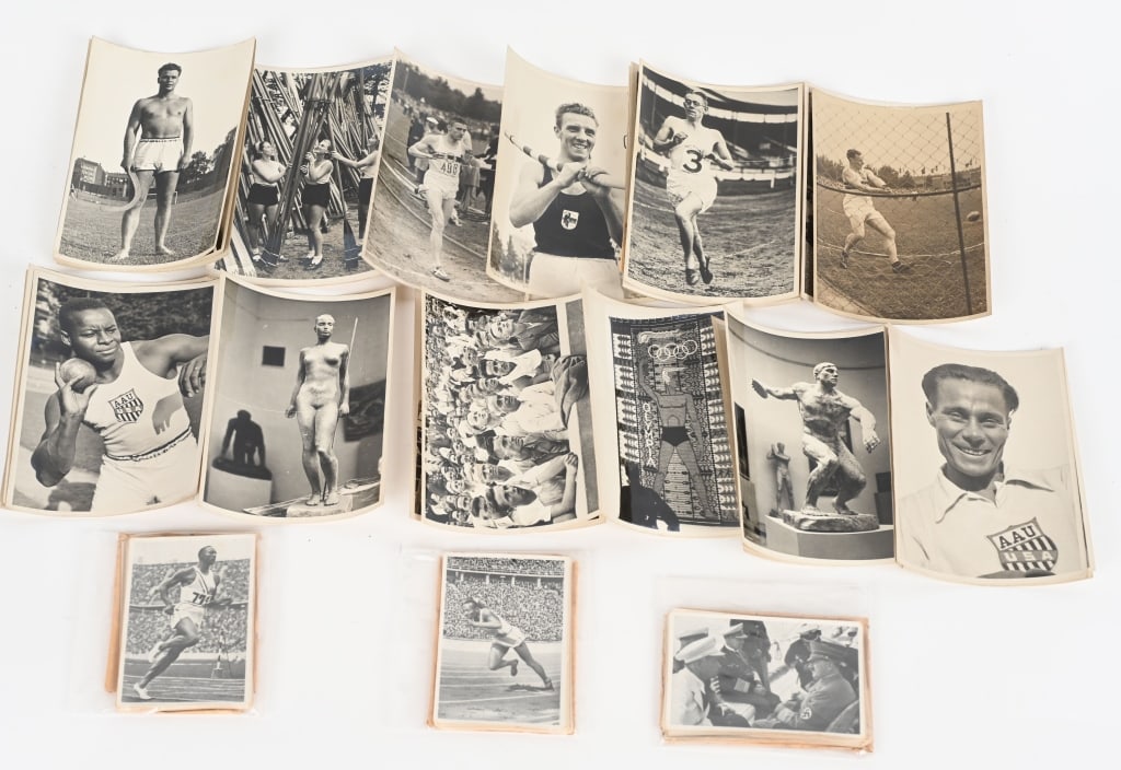 WWII NAZI 1936 OLYMPIC GAMES PRESS RELEASE PHOTOS: WWII Nazi German collection of 149 photos from the 1936 Olympic Games Cigarette Card Books and 32 Olympic Press Releases with the written descriptions to the reverse. Excellent. The 1936 Summer Olympi