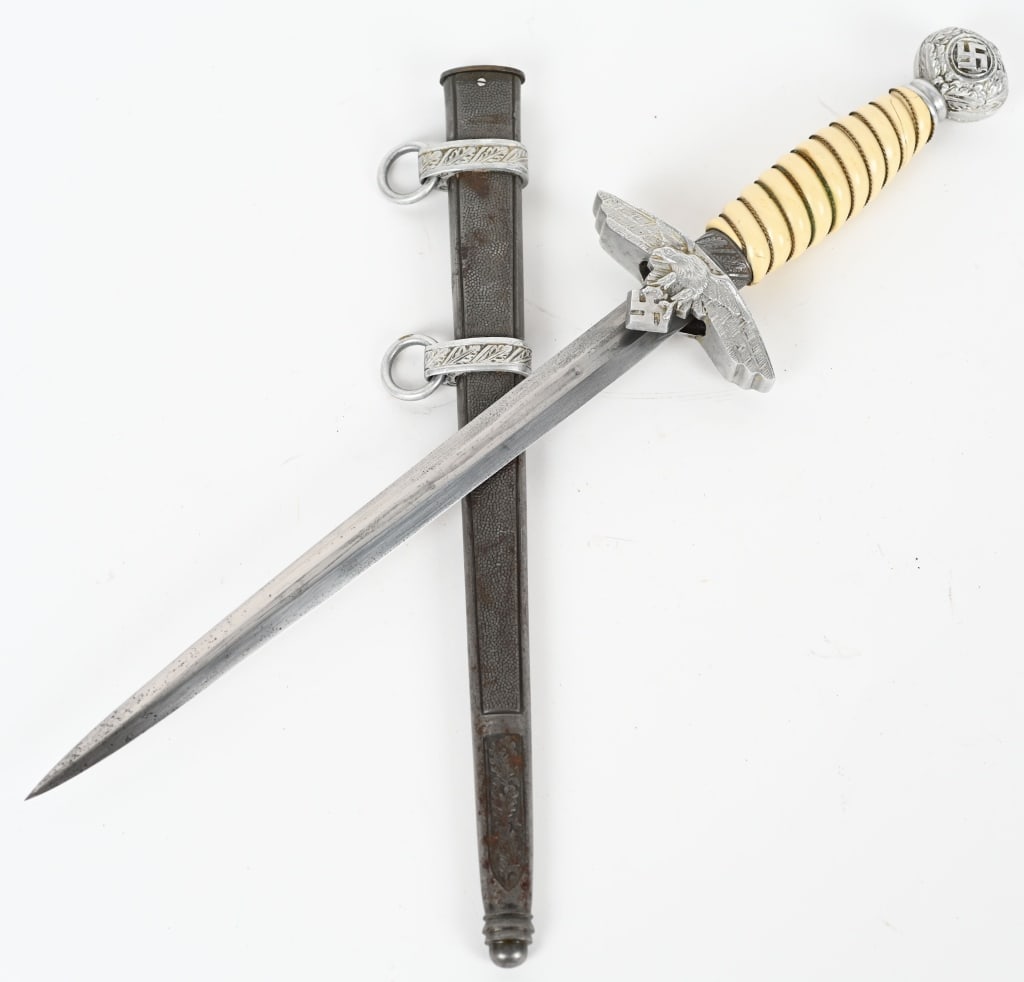 WWII NAZI GERMAN 2ND MODEL LUFTWAFFE DAGGER WW2: Nazi German 2nd model luftwaffe dagger. The blade is 10" and 17" overall. The blade is unmarked. The handle is white bakelite with original wire but does have a couple of hairlines. Excellent. In