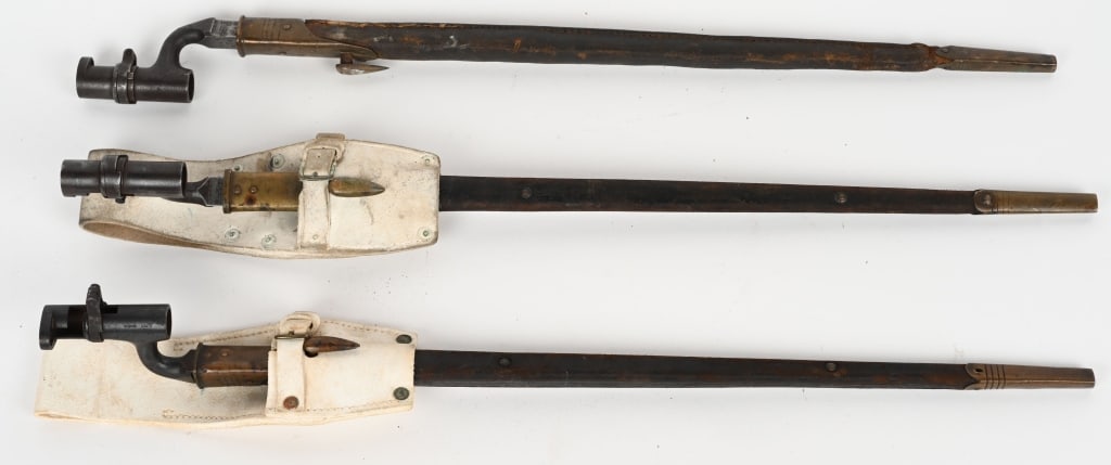 BRITISH BAYONET LOT P1876 & P1895 WITH SCABBARD: Lot of three British Bayonets to include 1) P1876 Socket Bayonet for the Martini Henry Rifle with scabbard a white buff frog 2) British P1895 Socket Bayonet for the .303 Martini Enfield Rifle with sca