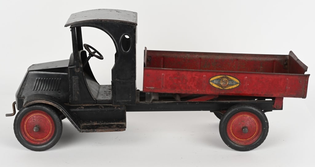 AMERICAN NATIONAL MACK BULLDOG DUMP TRUCK: All original with excellent paint and decals. Has front crank that raises dump body and make motor sound. A hard to find truck. 28" Excellent