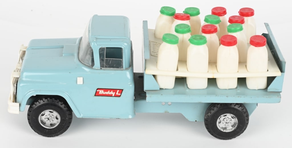 BUDDY L DAIRY TRUCK: All original with excellent paint and decals. Comes with load of Milk Bottles. Mirror brokenand small crack in bottle carrier. 14" Excellent