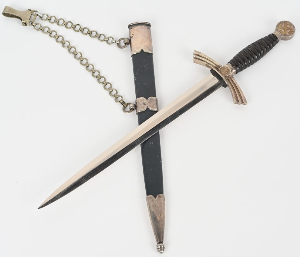 WWII NAZI GERMAN LUFTWAFFE DAGGER WEYERSBERG: 1st Model (1934/35) Luftwaffe dagger and hanger with nickel silver crossguard, pommel, and scabbard fittings. Blade marked Paul Weyersberg Solingen with their logo. Leather grip has minor wear with al