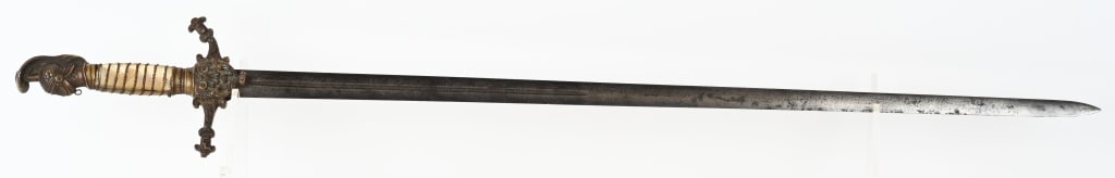 EARLY PRE CIVIL WAR KNIGHTS HEAD US MILITIA SWORD: Early US Militia Officers Sword with Knights Head Pommel. The Mother of Pearl Grip are wrapped in wire and is in excellent condition. The crossguard is very ornate with a scroll & floral mot