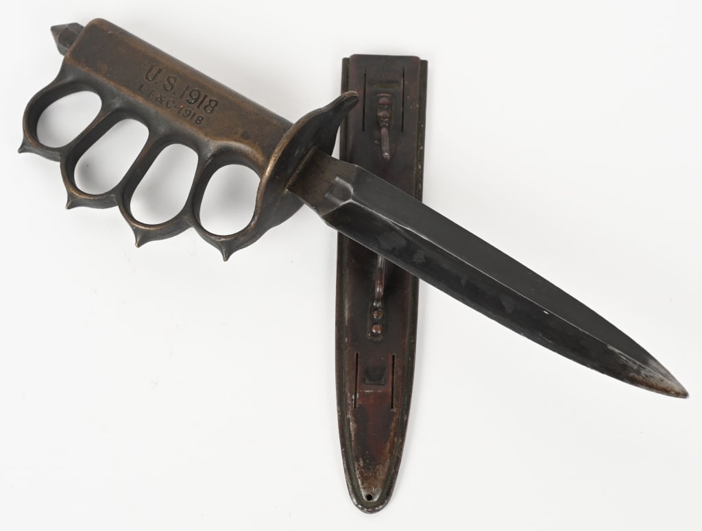 WWI US M1918 TRENCH KNIFE LF&C W/ SCABBARD WW1: Excellent Condition Model 1918 "Knuckle Duster" Trench knife with solid brass handle made by Landers, Frary, and Clark and so marked "L. F. & C." on the handle and on the scabbard. Features spiked knu