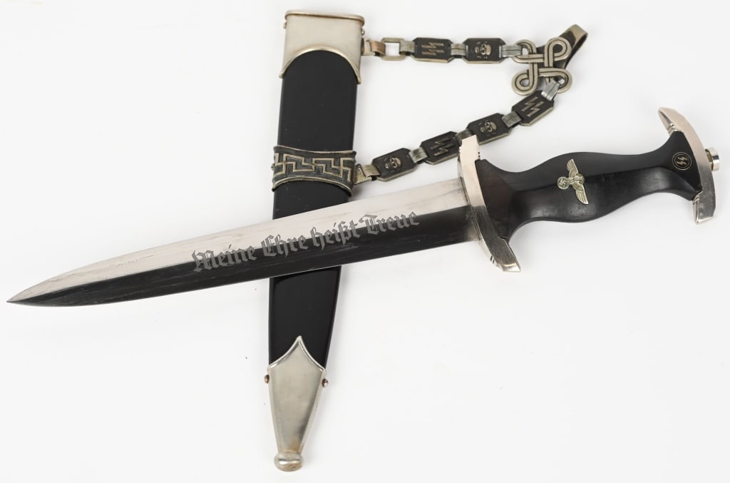 WWII NAZI GERMAN CHAINED M36 SS SERVICE DAGGER WW2: M36 service dagger features a roughly, 8 5/8", (22 cm), long, double edged, nickel/silver plated, drop forged steel construction blade with a low central ridge and a full length, including the hilt, o