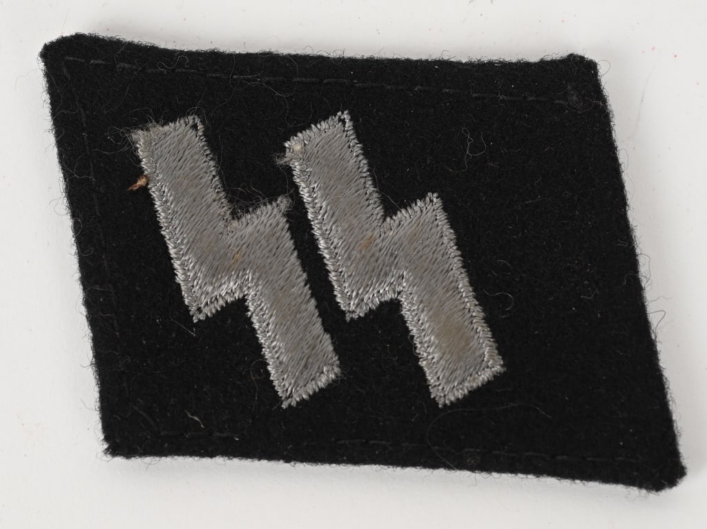 WWII NAZI GERMAN WAFFEN SS RUNIC COLLAR TAB RZM: Right hand side, circa 1940-1945 pattern, un-piped, black wool construction collar tab with machine embroidered SS runes in silvery/gray cotton threads. The runes stand in nice high relief on the coll