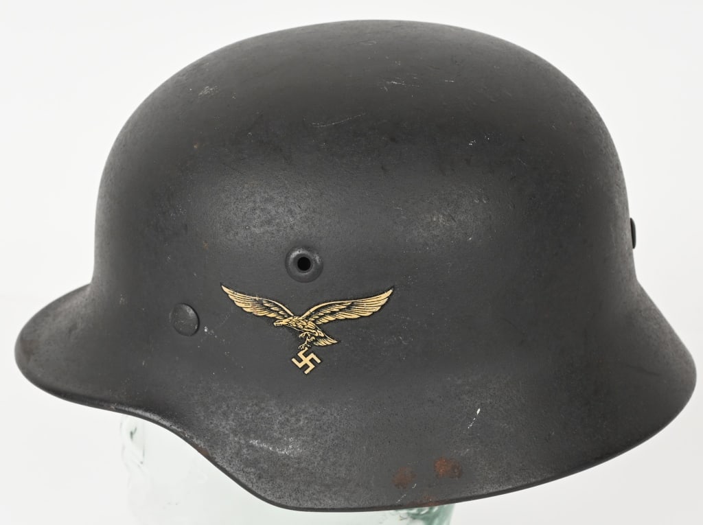 WWII NAZI GERMAN M40 LUFTWAFFE HELMET W LINER MINT: The stamped, sheet steel construction M40 helmet retains most of its slightly rough textured, Luftwaffe blue/grey paint. The left side of the helmet has a second pattern, (circa 1936/1937-1945), Luftw