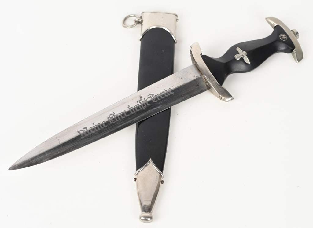 WWII NAZI GERMAN SS DAGGER BY EICKHORN WW2: Nice quality dagger features a roughly, 20cm long, double edged, drop forged steel construction, nickel/silver plated blade with a low central ridge. The nickel/silver plated blade shows light scabbar