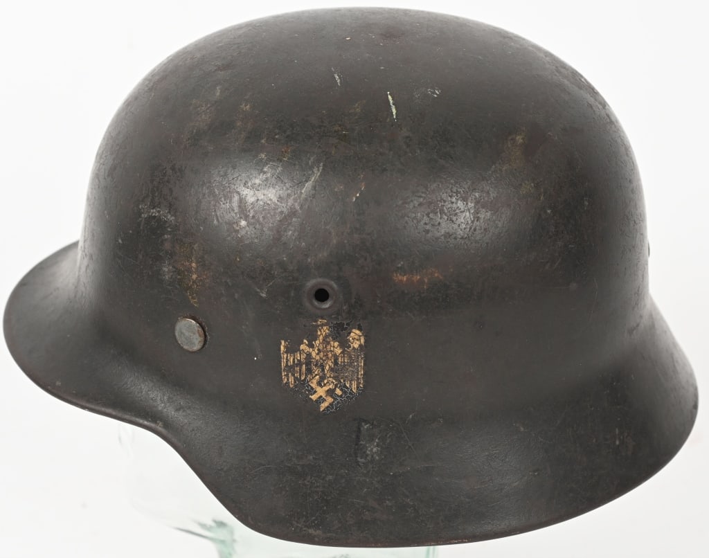 WWII NAZI GERMAN KRIEGSMARINE M40 SD HELMET WW2: The stamped, sheet steel construction helmet retains a good portion of its original feldgrau paint. The left side of the helmet has a golden yellow, Kriegsmarine eagle shield decal. All three liner re