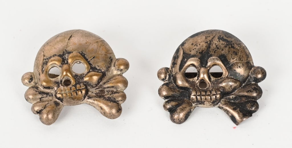 WWII NAZI GERMAN PANZER COLLAR TAB SKULLS WW2: Pair of silver washed, stamped alloy construction, Prussian "Danziger" style skulls and crossbones feature circular eye and triangular nose cut-outs, embossed cranium detailing and dual rows of teeth 