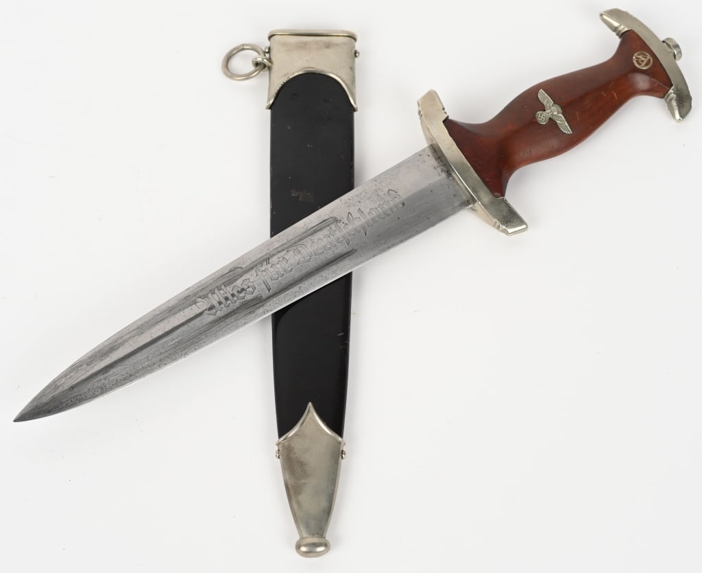 WWII NAZI GERMAN NSKK DAGGER BY R. HAASTERT: Roughly, 22cm long, double edged, nickel/silver plated, drop forged steel construction blade with a low central ridge. The blade shows the expected scabbard runner marks and graying. The obverse of th