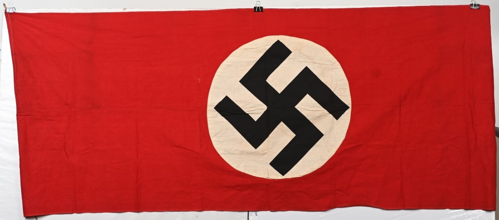 WWII NAZI GERMAN NSDAP SMALL FLAG / BANNER WW2: Roughly 29 x 75 inches, double sided cotton construction pennant. The pennant features a red base field with a separate central white circular disk with a printed canted black swastika to its center.