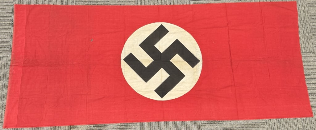 WWII NAZI GERMAN NSDAP LARGE FLAG / BANNER WW2: Roughly 49 x 116 inches, double sided cotton construction pennant. The pennant features a red base field with a separate central white circular disk with a printed canted black swastika to its center.