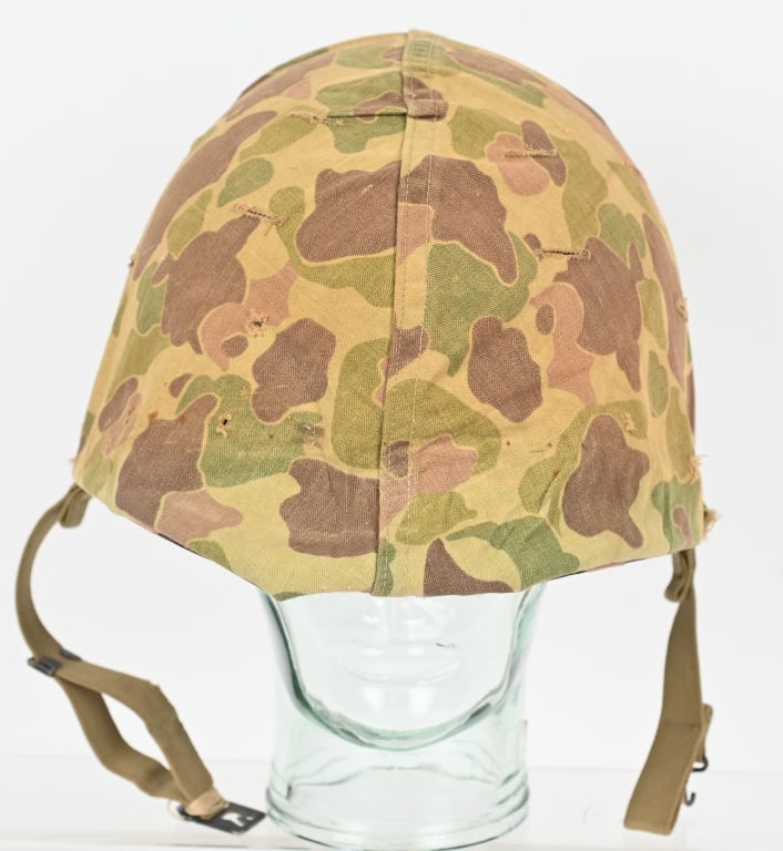 WWII U.S. M 1 HELMET WITH USMC HBT CAMO COVER WW2: Front seam fixed bale M1 helmet with a United States Marine Corps HBT camouflage cover. Firestone liner. Excellent. The M-1 helmet was developed as a replacement for the M-1917 helmet that had se