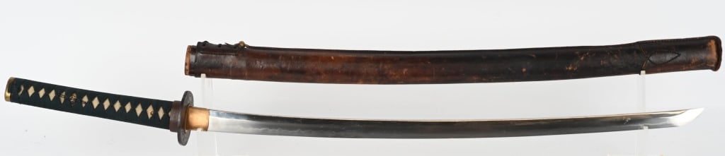 JAPANESE KATANA SWORD w/ SIGNED TANG: The Katana has a 25 1/2" cutting edge. Blade has 1 hole tang signed on one side. The bright blade has a keen cutting edge and active hamon.. The habaki is brass, and the Tsuka has a ray skin grip and 