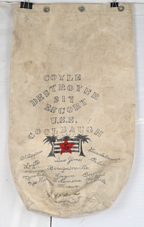 WWII US NAVY USS COOLBAUGH DE-217 PAINTED SEABAG: Stellar Hand Inked Seabag from a member who served on the USS Coolbaugh DE-217. Excellent diary seabag listing of all the countries that the sailors last name was Coyle. Excel