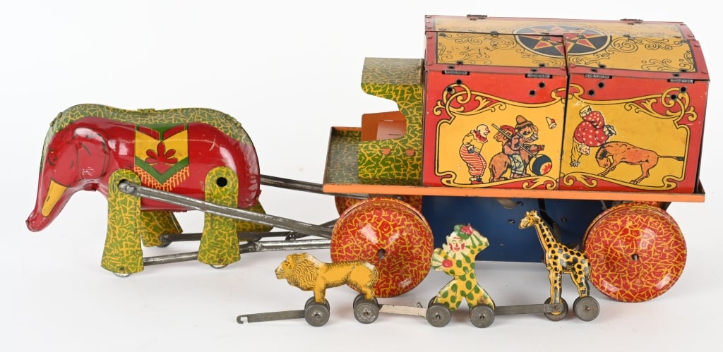 LINDSTROM TIN WINDUP ELEPHNAT CIRCUS WAGON: All original with great colors and graphics. Still has cages with animals. Windup works. Nice looking toy. 17" Excellent