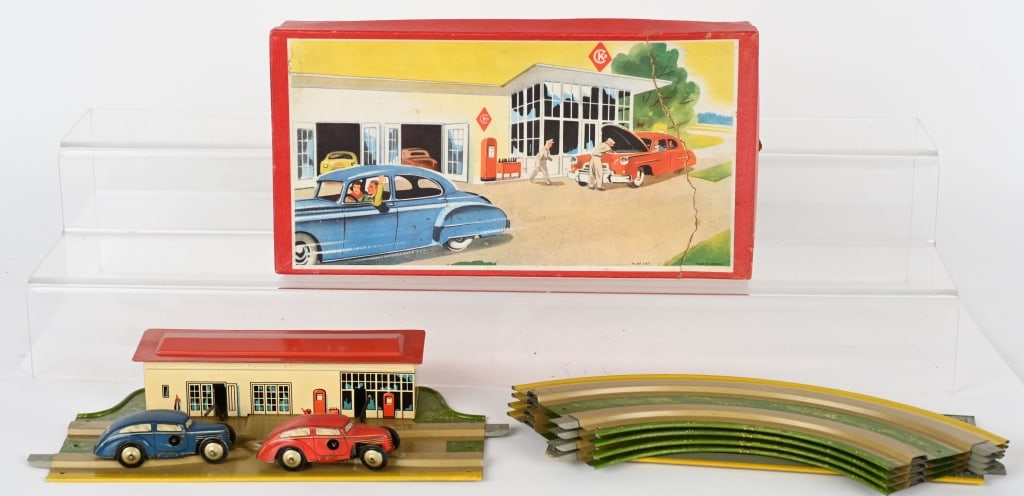 CKO TIN WINDUP CARS & GAS STATION w/ BOX: Made in Germany. All original with 2 cars. Windups work. Boxed 12" Excellent