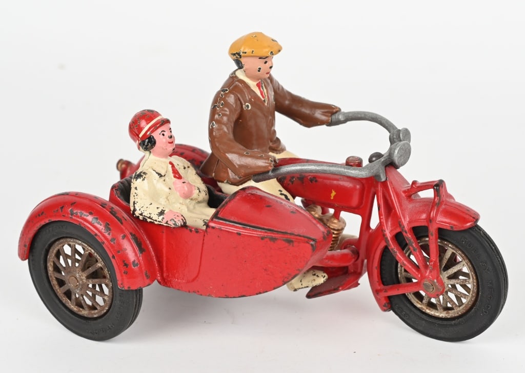 HUBLEY CAST IRON INDIAN MOTORCYCLE & SIDECAR: Original cast iron Indian motorcycle with sidecar. Nice original paint and decals. Cast iron figures and tires are replacements. No cracks or repairs to cycle. 8 3/4" Excellent