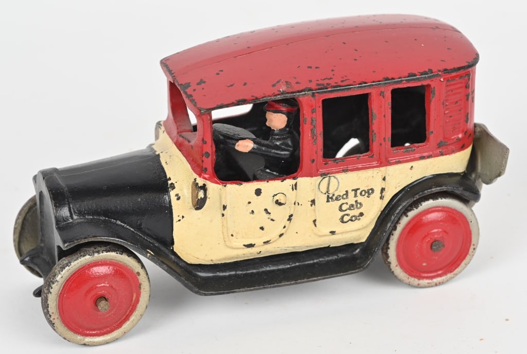FRIEDAG CAST IRON RED TOP CAB: Nice original toy that has been expertly restored and aged. No cracks or repairs. 7 3/4" Excellent
