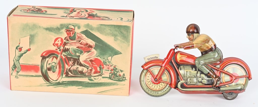 TECHNOFIX TIN WINDUP MOTORCYCLE w/ BOX: Technofix motorcycle is complete and original with a nice box. The cycle is marked U.S. Zone Germany and the box is marked Western Germany. Windup works. 7" Excellent-Near Mint