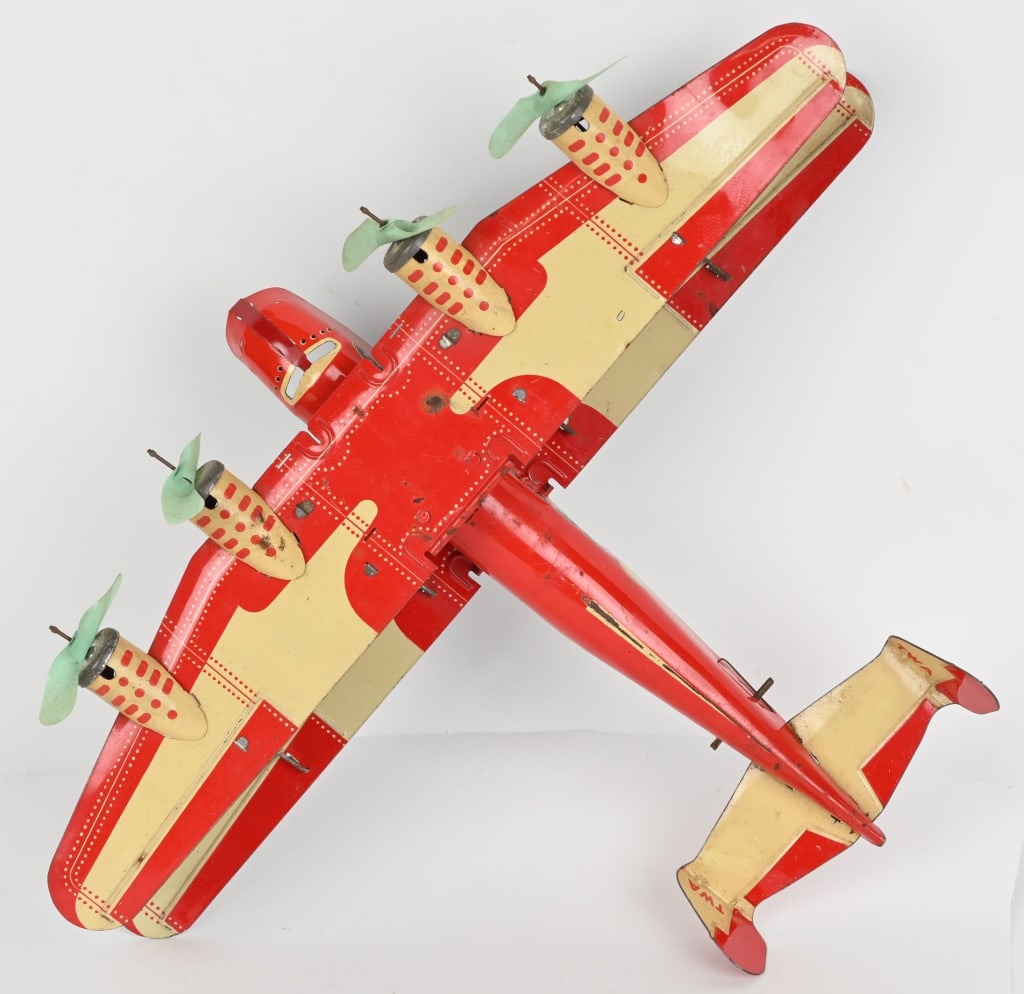 MARX TIN WINDUP 4- MOTOR U.S. MAIL BIPLANE: Complete with original celluloid propellers. Windup works. Nice colors with light wear. 18" wing span. Very Good-Excellent