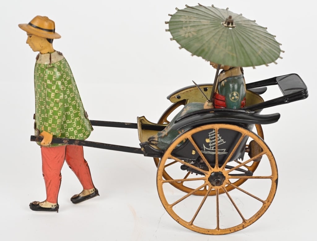 LEHMANN TIN WINDUP MASUYAMA: Lehmann tin windup Masuyama. Very detailed fragile toy All original including fan and umbrella. Windup works. 7" Excellent