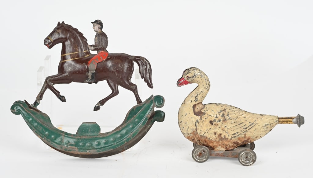 2- EARLY HAND PAINTED TIN TOYS: Lot includes 1. 6" American tin Jockey on Horse rocker. Has paint wear and base has come apart at seams. 2. 5 3/4" hand painted Swan on wheels with horn in tail. Has paint loss and wear. Good-Very Goo