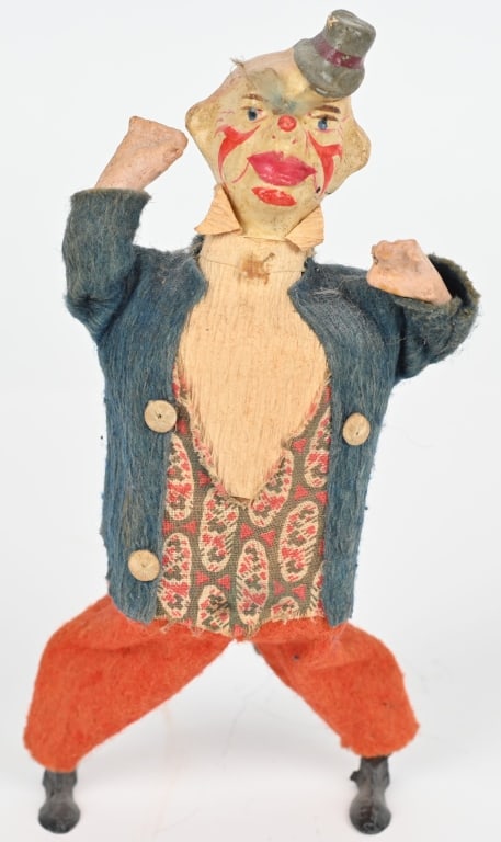 GERMAN WINDUP DANCING CLOWN: Early German windup Dancing Clown. Hand painted composition head, cloth dressed with lead feet. Very nice details. Windup works. 8" Excellent