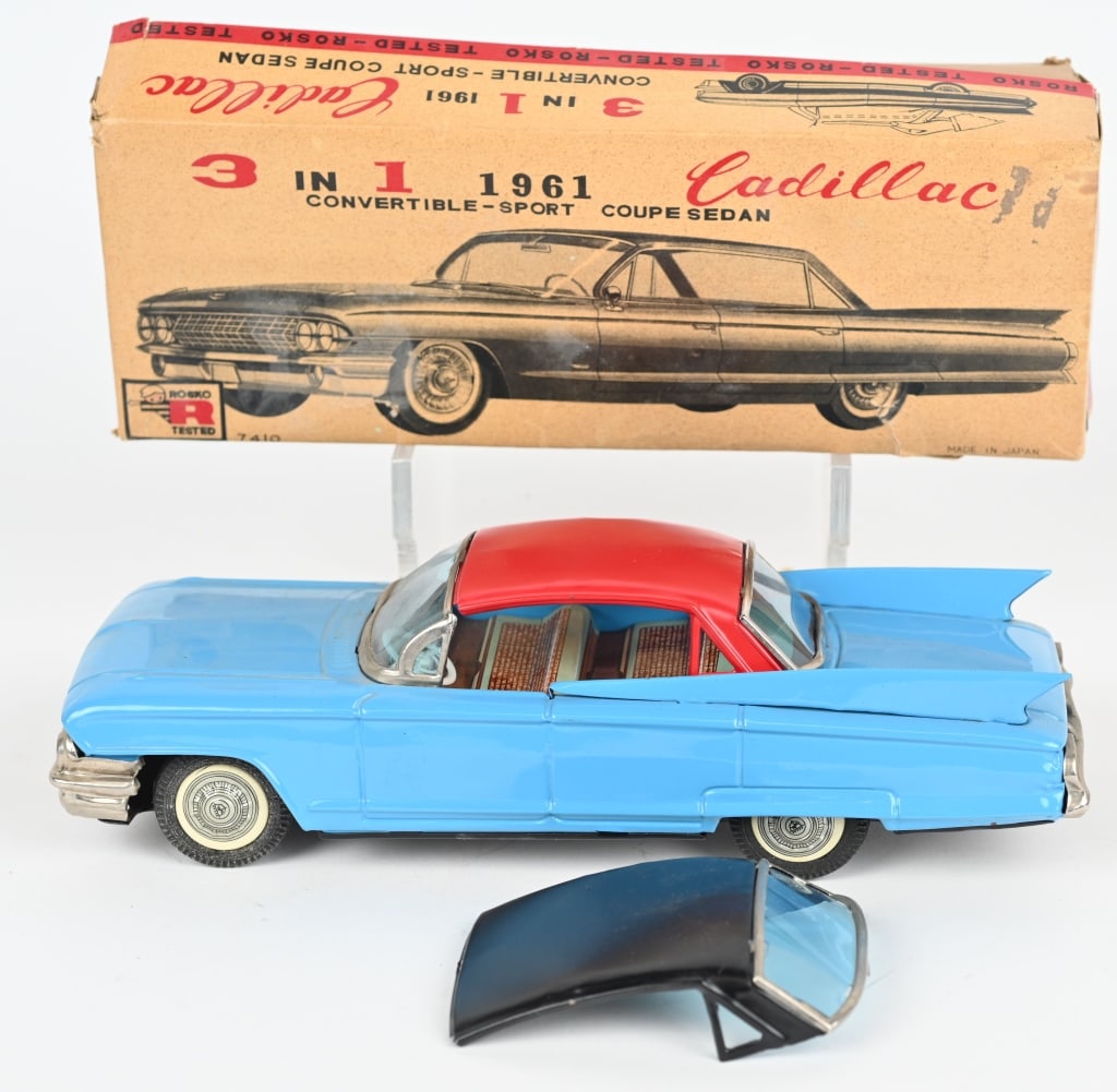 JAPAN TIN FRICTION 3 IN 1, 1961 CADILLAC w/ BOX: Japan tin friction 3 in 1 Cadillac. All original and complete with 2 Tops. Friction works. Includes colorful original box hat has wear. 9 1/2" Excellent